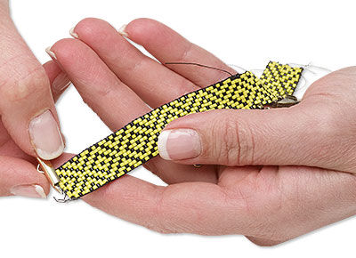 End bar being slid onto beaded strip